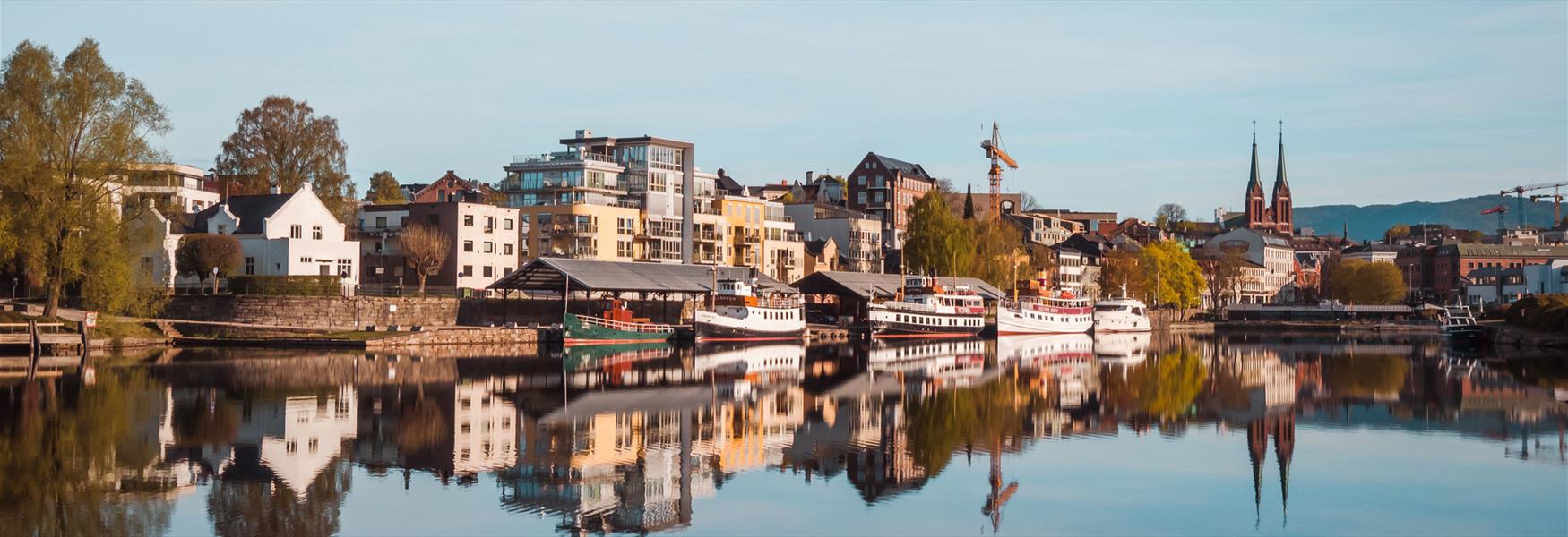 the canal boats are located on Hjellebrygga in Skien