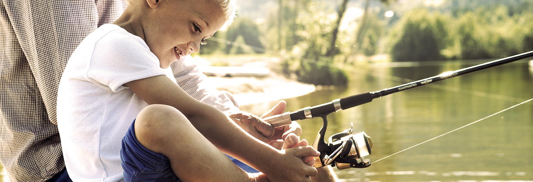 Boy fishing at the Telemark Canal in Telemark