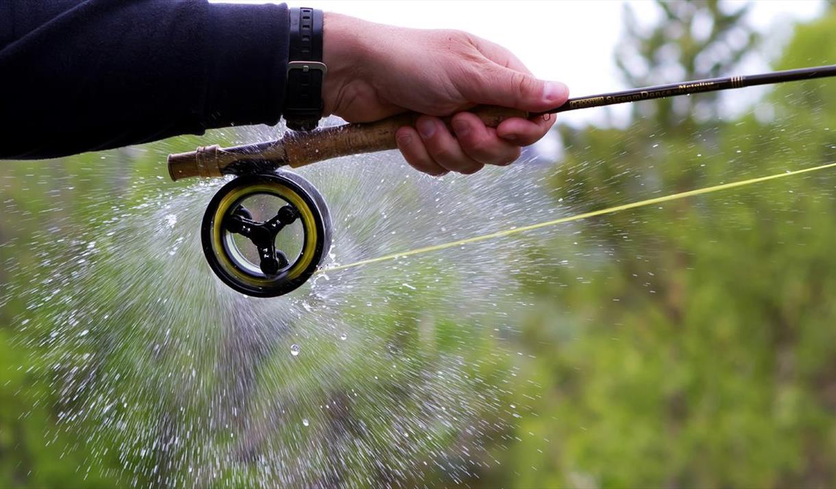 man holding fishing rod