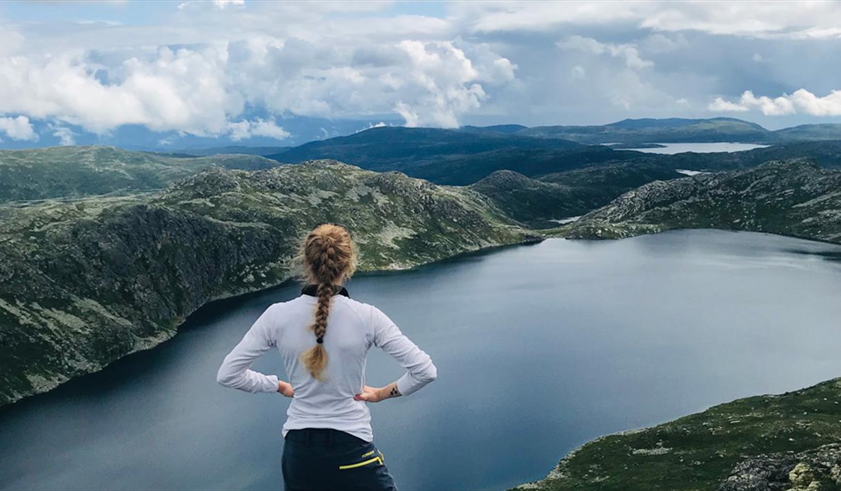 girl standing on topp of Mount Toreskyrkja