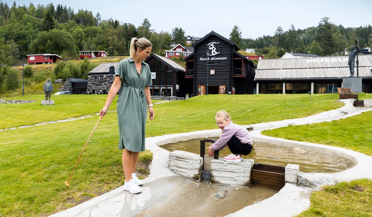 mother and daughter play in the water park at the Norwegian skiing museum