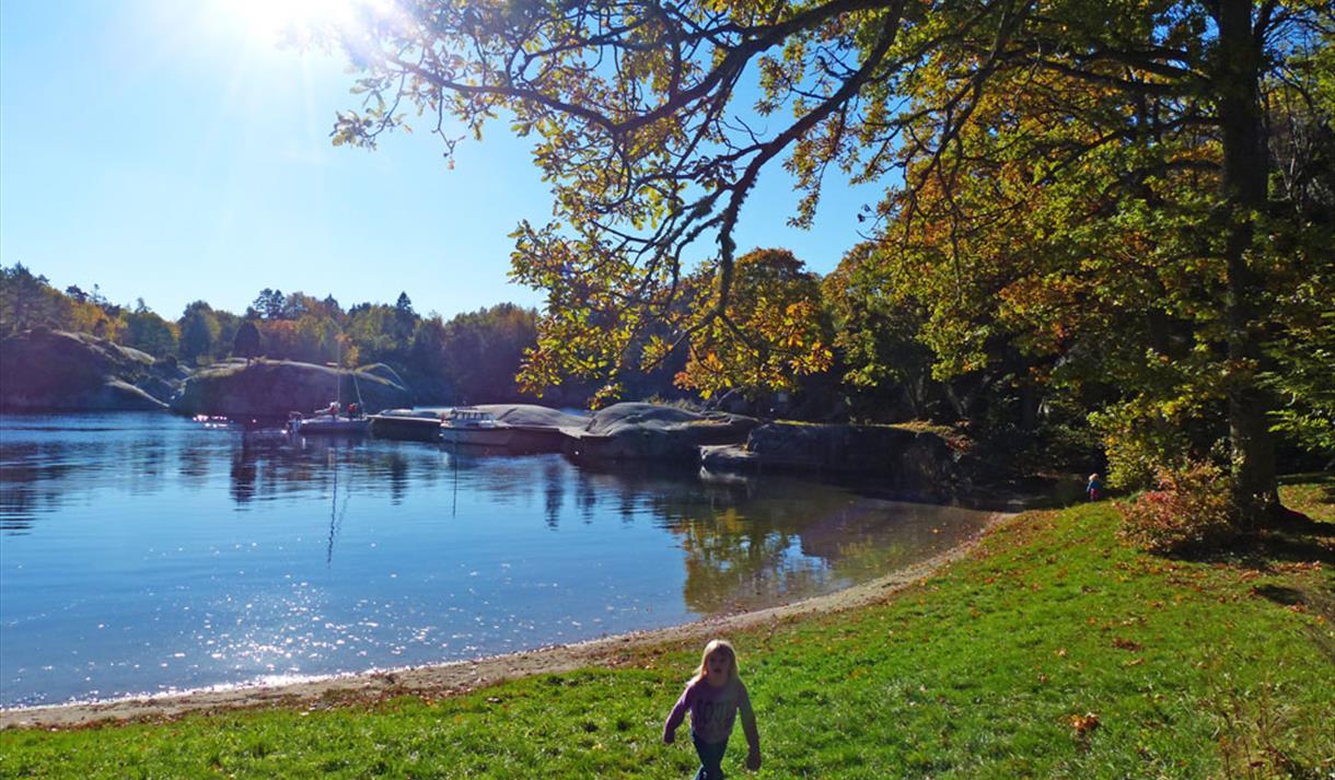 little girl on a nice beach on the island Håøya in Porsgrunn