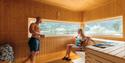 Couple enjoying the warmth in Saga Sauna.