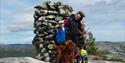 with children and dog on top of mount Napen