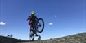 cycling over boulders on Gautefallheia in Drangeda
