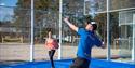 man and woman play padel tennis in Skien leisure park