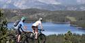 cycling over boulders on Gautefallheia in Drangedal, break at the top with a view
