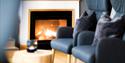 the fireplace in the lounge at the Home Hotel Bryggeparken